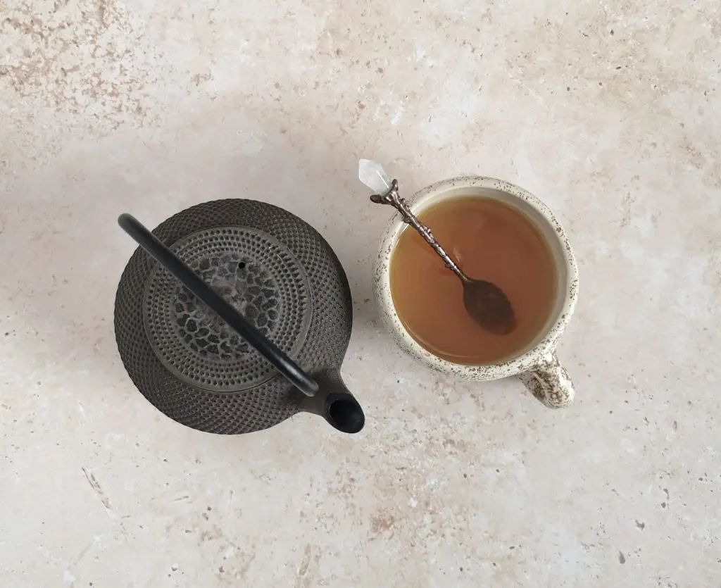 A simple ritual for everyday life: a cup of coffee and a spoon are ready to make tea