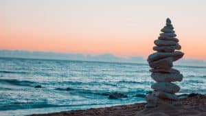 pile of white rocks on the seashore - peace for back-to-school energy protection