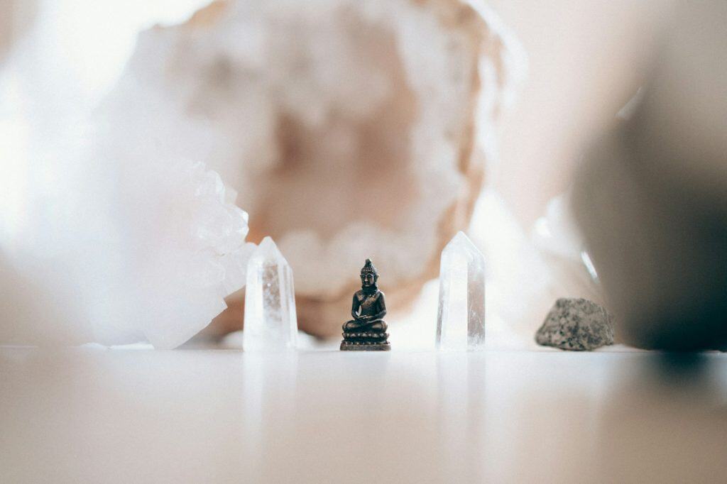 Sacred altar with crystals and symbols for grounding spiritual breakthrough experiences
