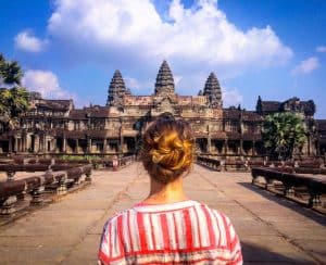 woman standing in front of Angkor Wat - a place for spiritual integration practice
