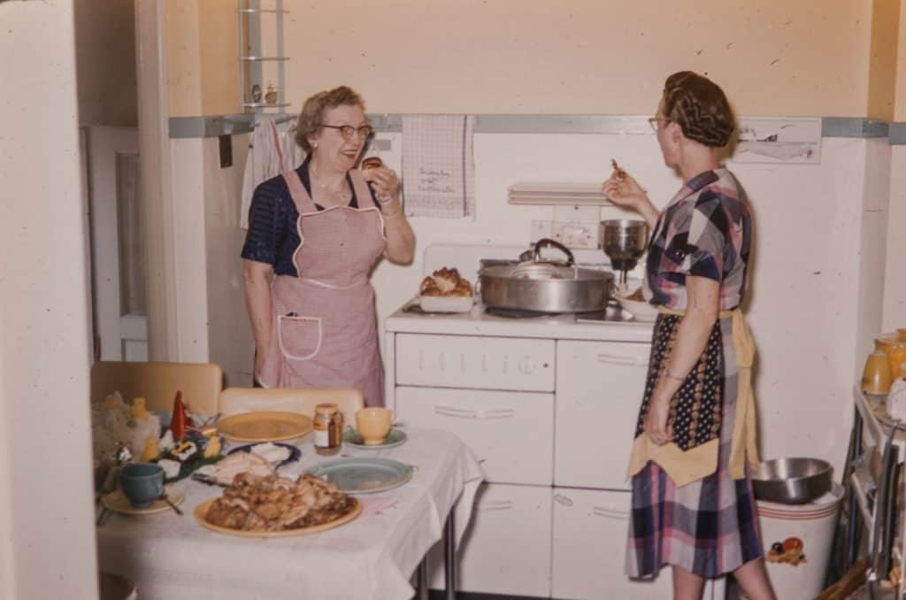 a couple of women standing in a kitchen connecting to ancestral wisdom