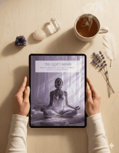 Woman's hands holding a tablet displaying The Quiet Mind digital spiritual toolkit.